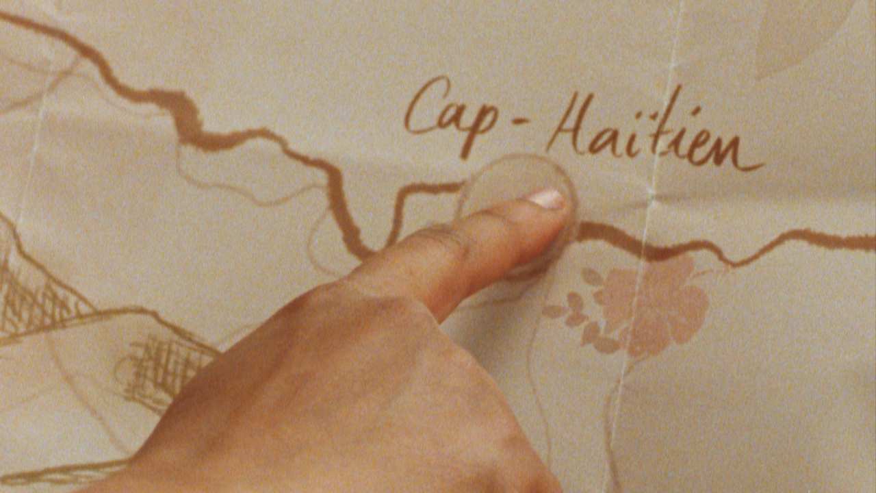 a finger pointing on a map